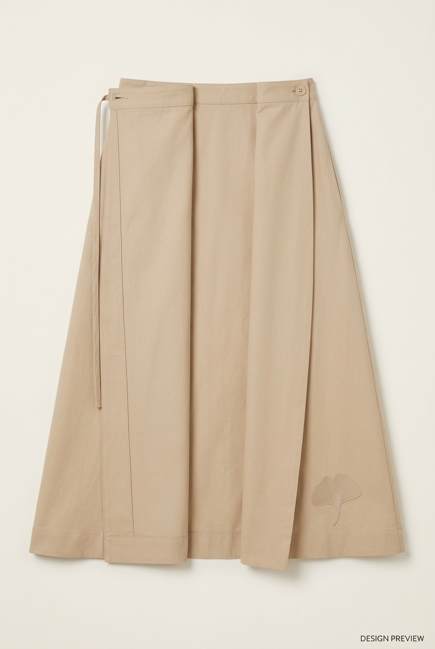 Design preview of the sand-coloured Ginkgo midi wrap skirt laid open, with tonal ginkgo detail.