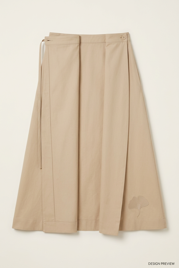 Design preview of the sand-coloured Ginkgo midi wrap skirt laid open, with tonal ginkgo detail.