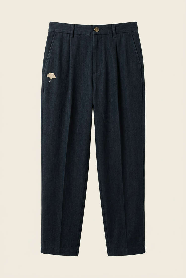 Navy relaxed trousers front with ginkgo below the wearer's right pocket