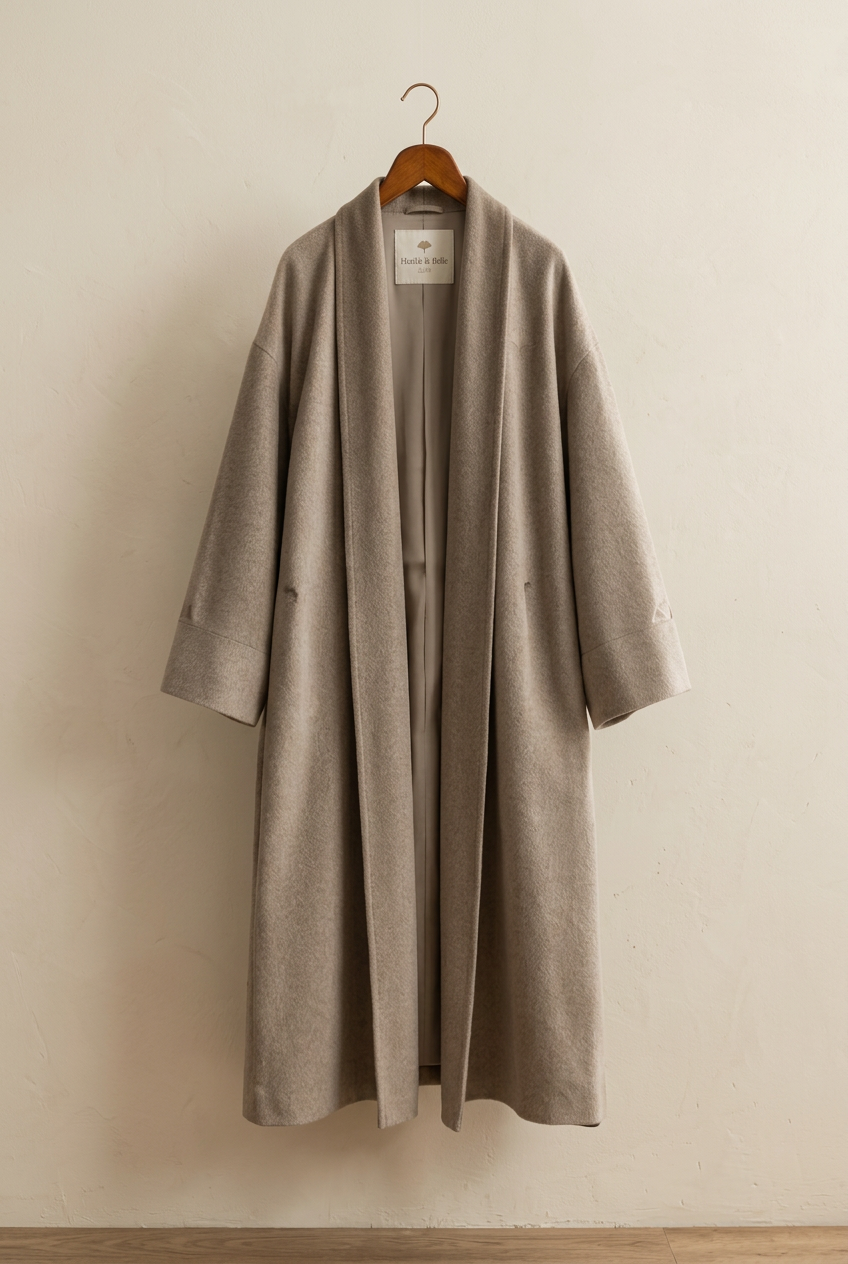 Herick & Belle men's wool coat on hanger with interior label