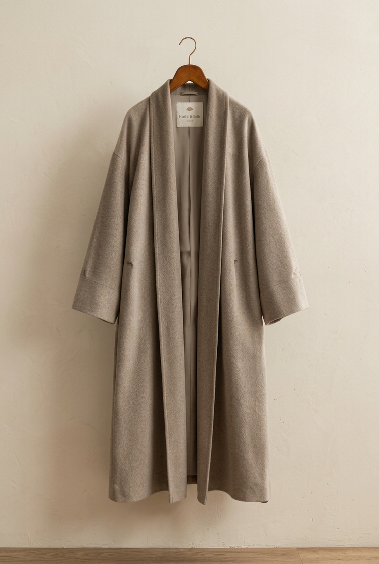 Herick & Belle men's wool coat on hanger with interior label