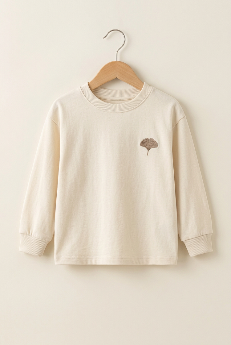 City Explorer junior long-sleeve tee in ivory, front on hanger