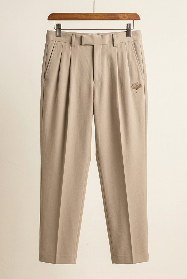 Herick & Belle Minimal Luxury sand ginkgo pleated trousers, front
