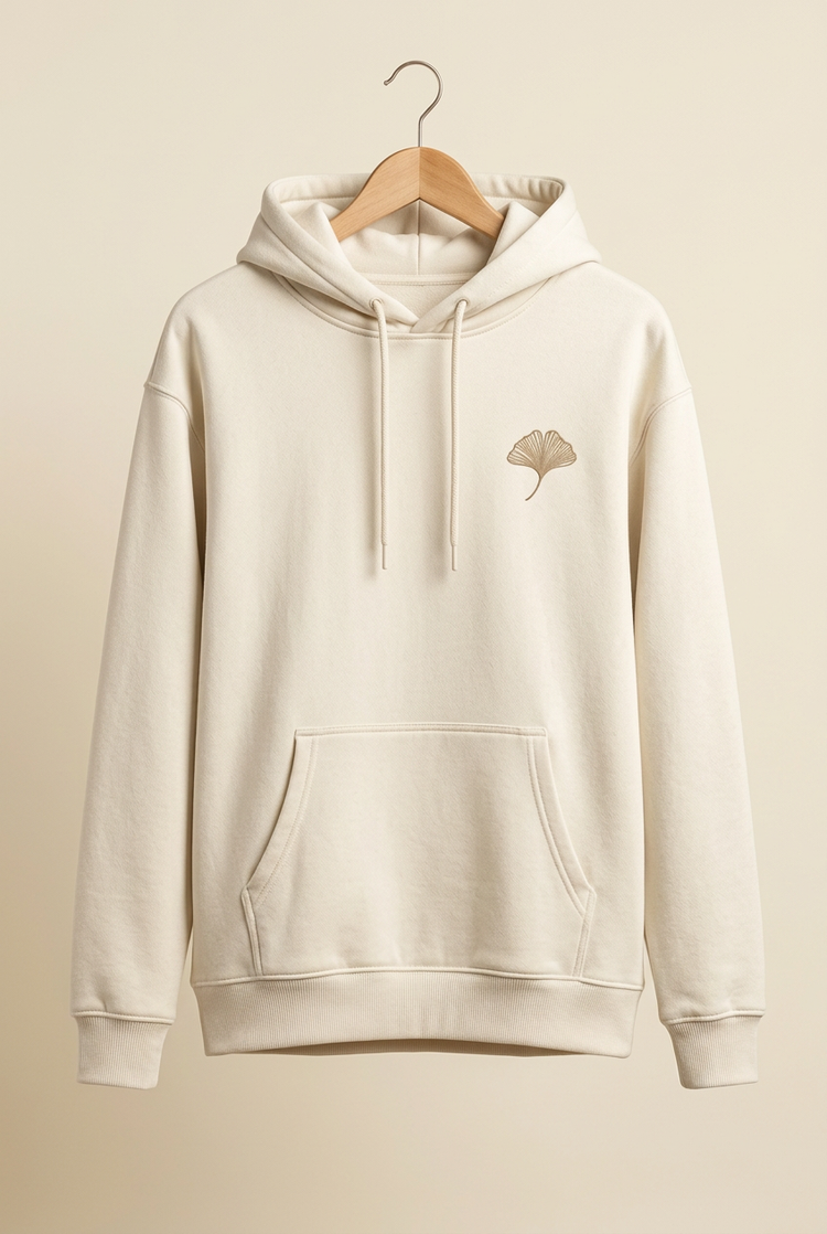 Outdoor Balance ivory hoodie on hanger, front