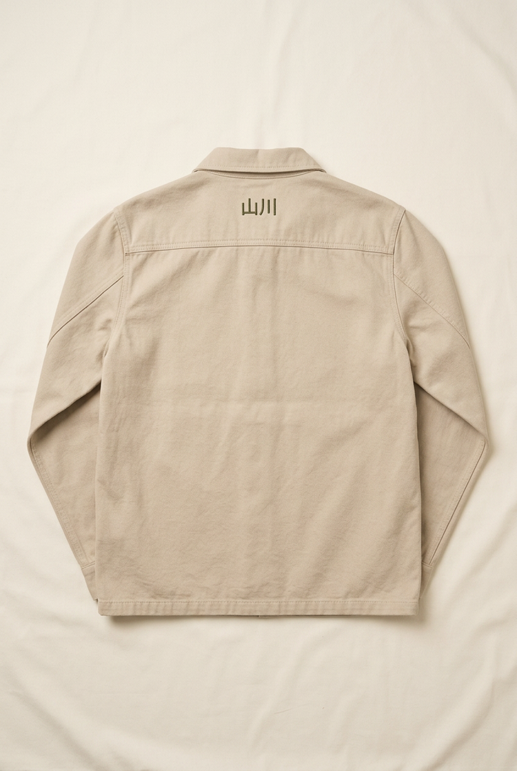 Sand SANSEN men's chore jacket, back with small 山川 embroidery below the collar