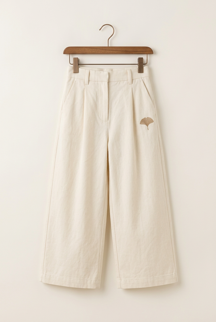 Minimal Luxury junior pleated trousers in ivory, front on hanger