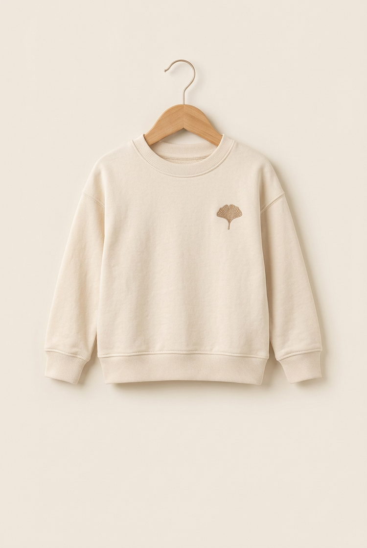 Soft Essentials junior sweatshirt in ivory, front on hanger
