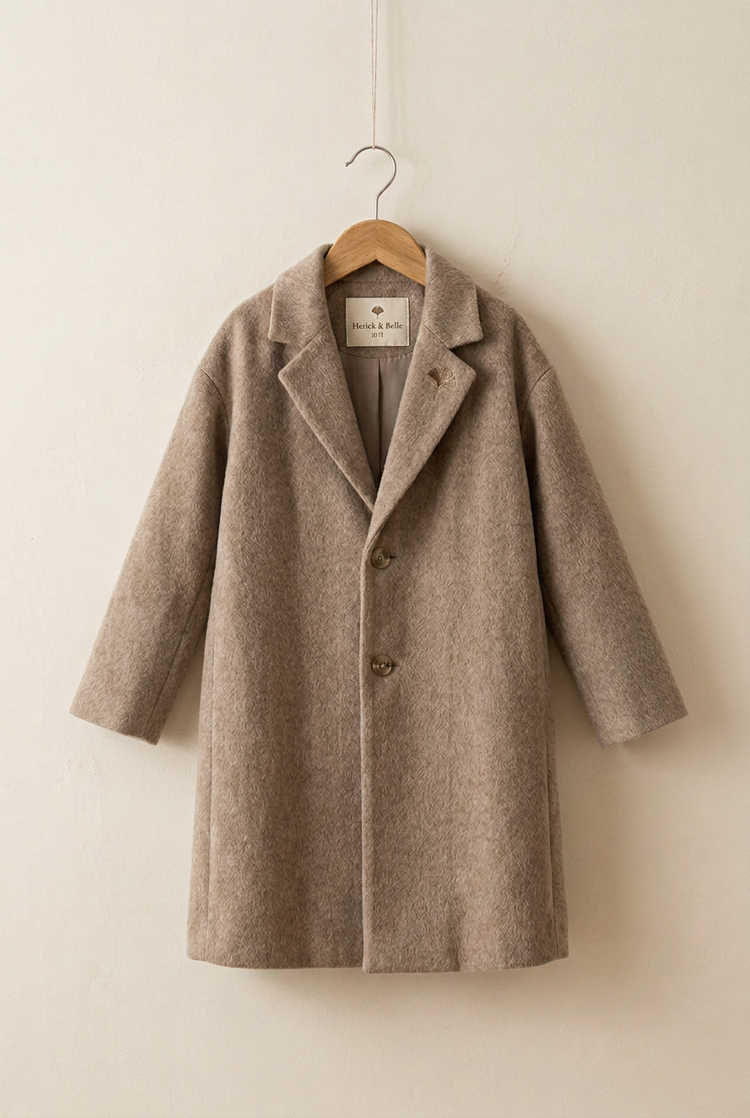 Herick & Belle junior wool coat on hanger with interior label