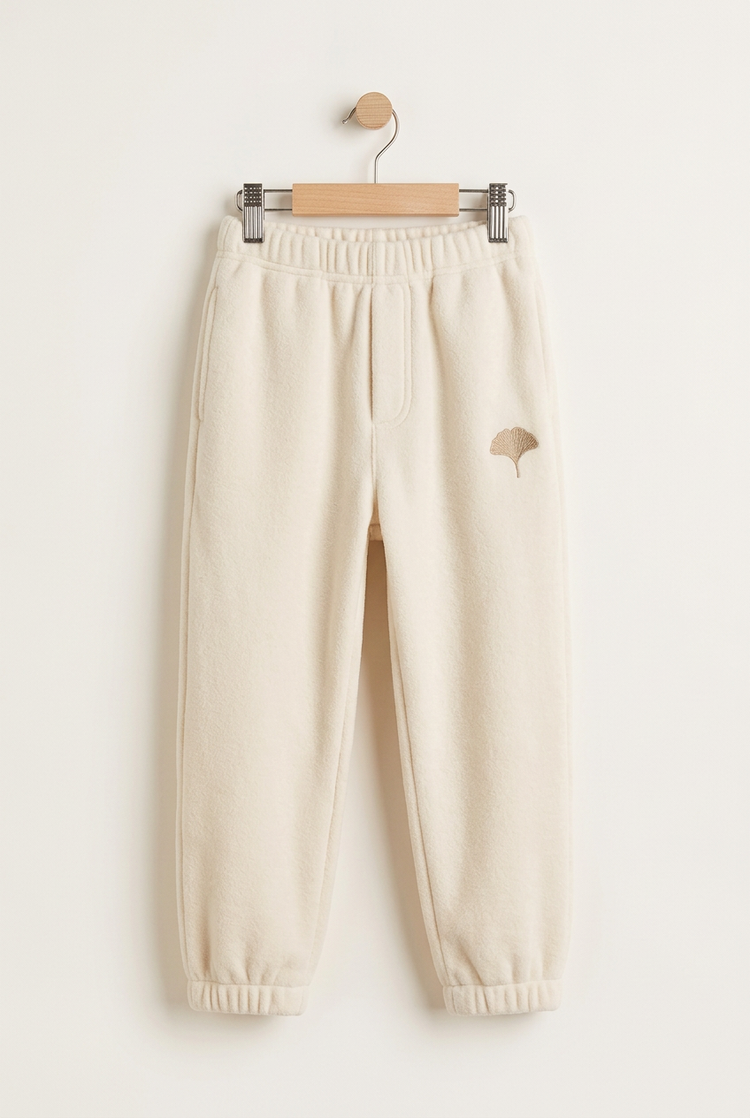 Sporty Minimal junior joggers in ivory, front on hanger